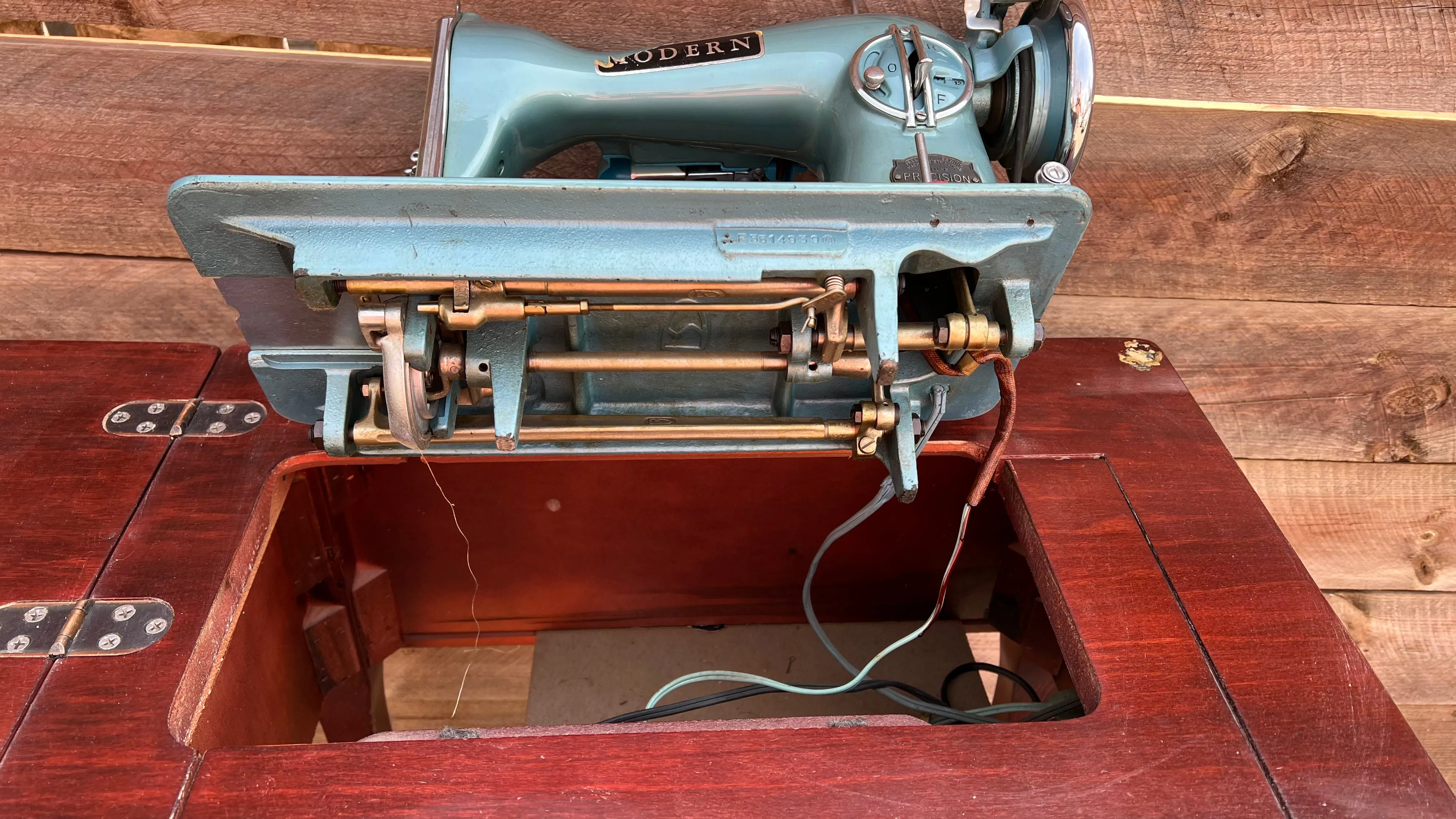 Sleek Modern Aqua Sewing Machine In Cabinet