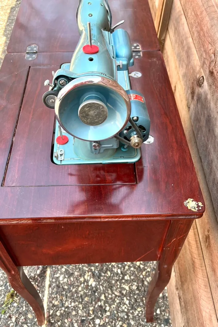 Sleek Modern Aqua Sewing Machine In Cabinet