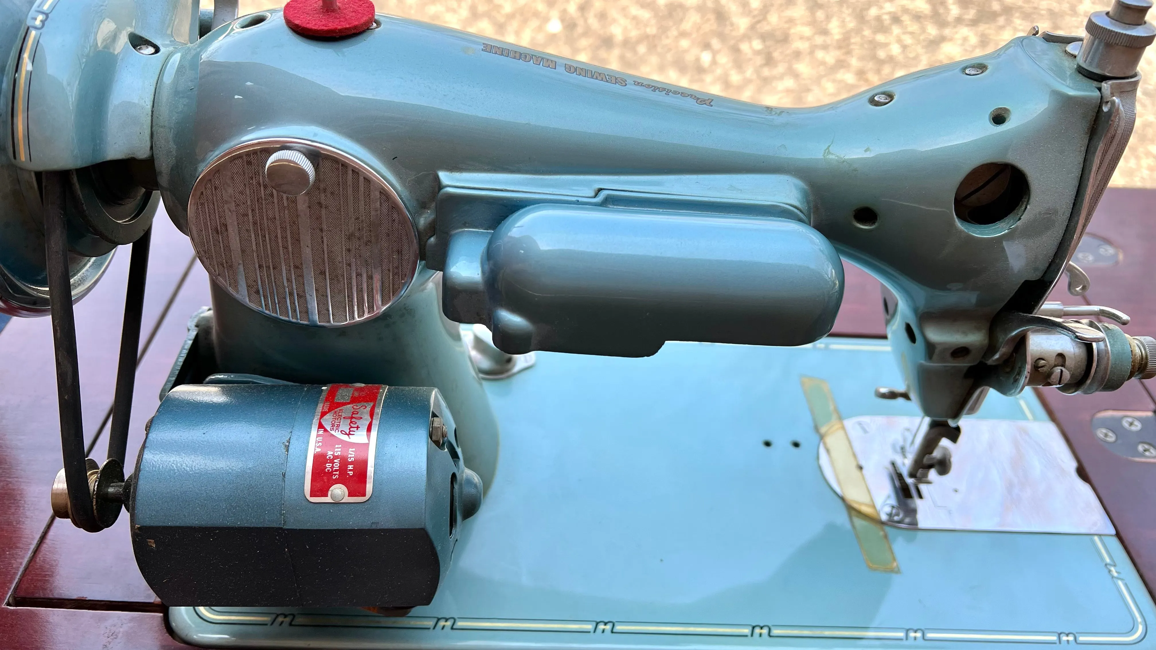 Sleek Modern Aqua Sewing Machine In Cabinet