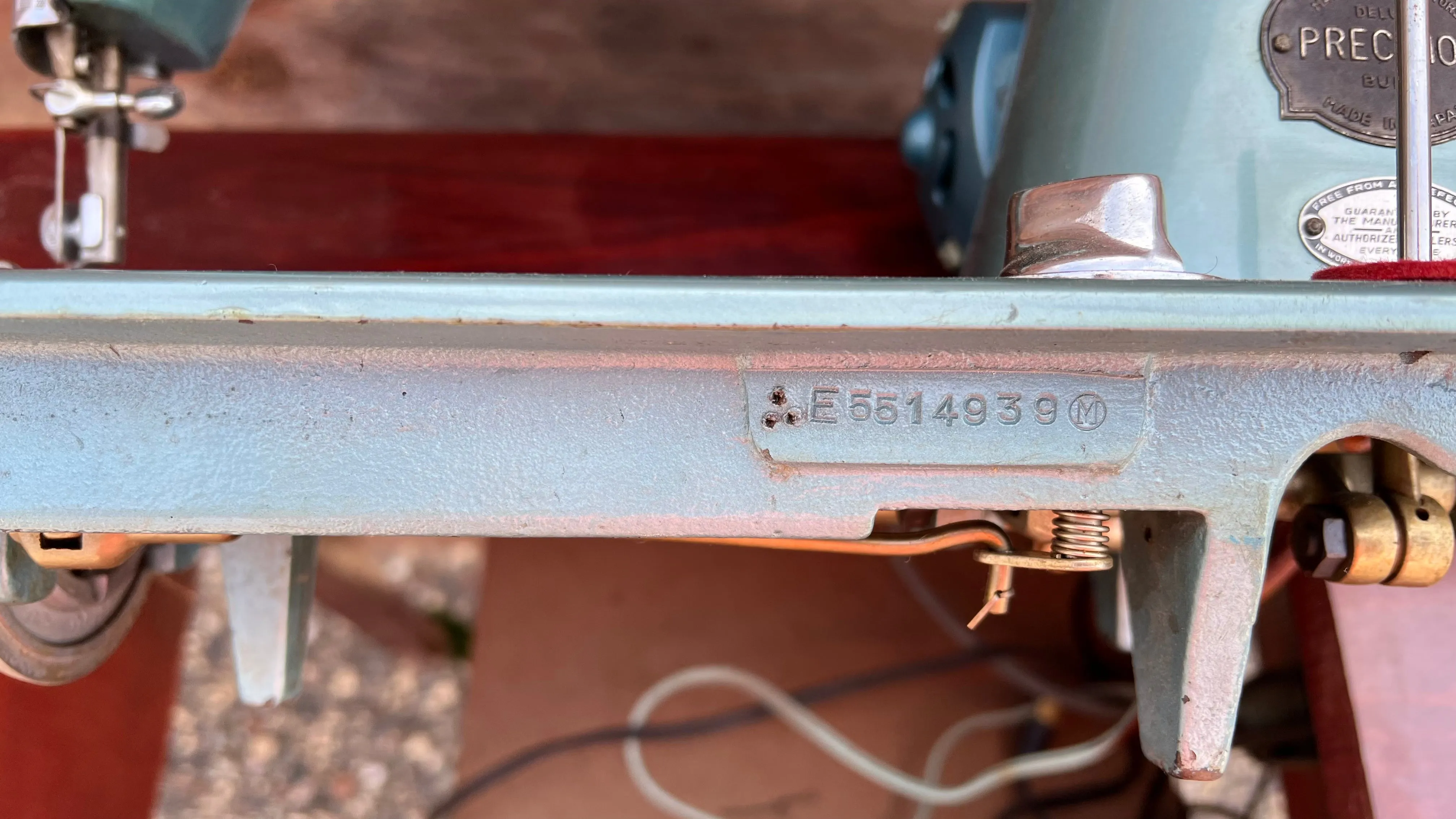 Sleek Modern Aqua Sewing Machine In Cabinet