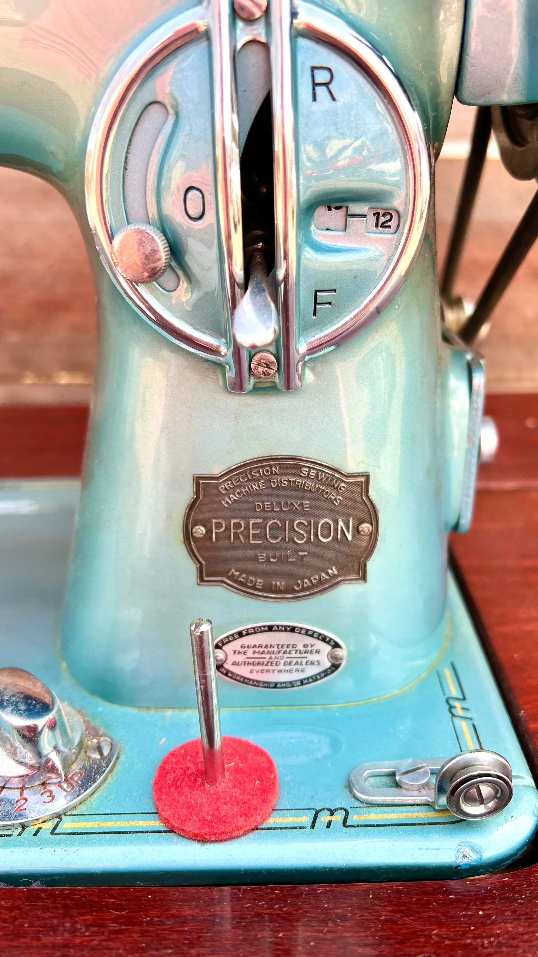 Sleek Modern Aqua Sewing Machine In Cabinet